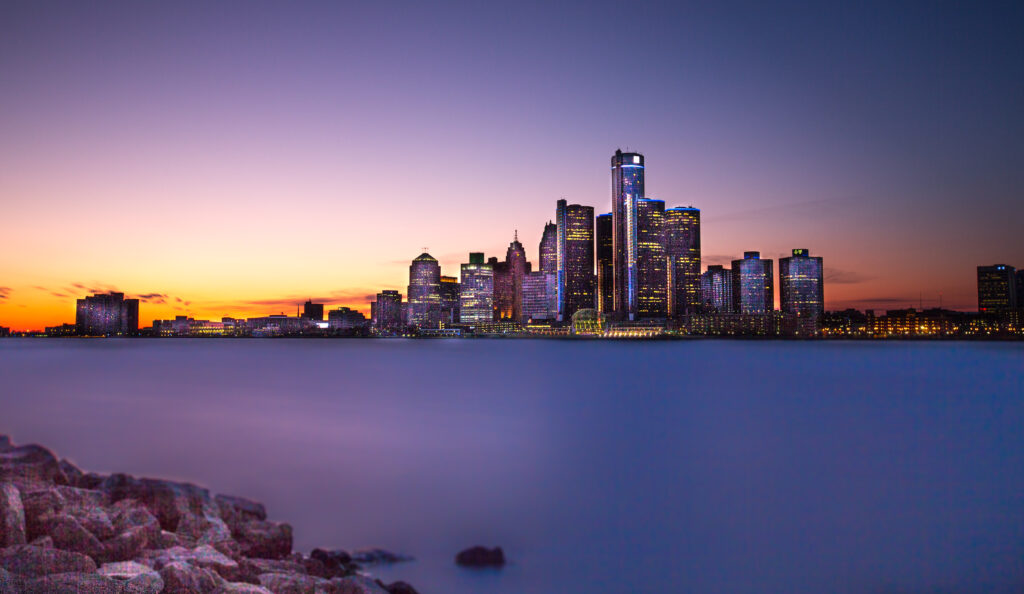 A view of Detroit, Michigan from across the Detroit River, in Windsor, Ontario. Twilight hour.