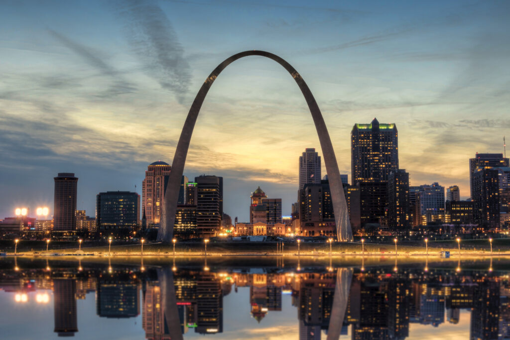 The St. Louis city skyline with Gateway Arch photographed at sunset.